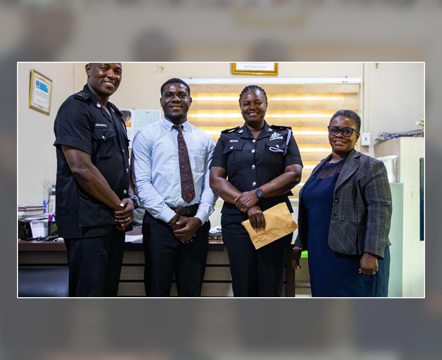 Staff of Prudential Bank presenting the cheque to the Commander of the Nima Police Station